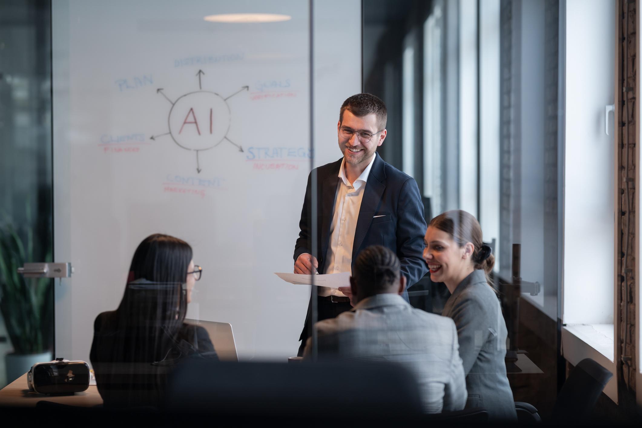 Business team in a office during a meeting, discussing artificial intelligence strategy.